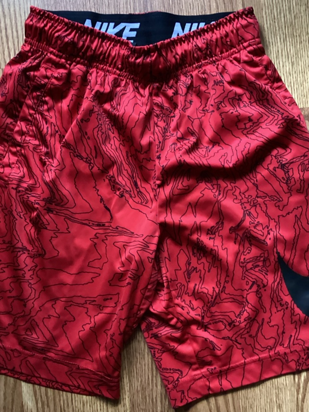 Nike Red Athletic Shorts with Black Topographic Print